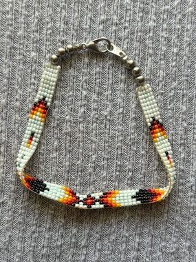 Orange, red, yellow, black, white & green microbeaded geometric design bracelet